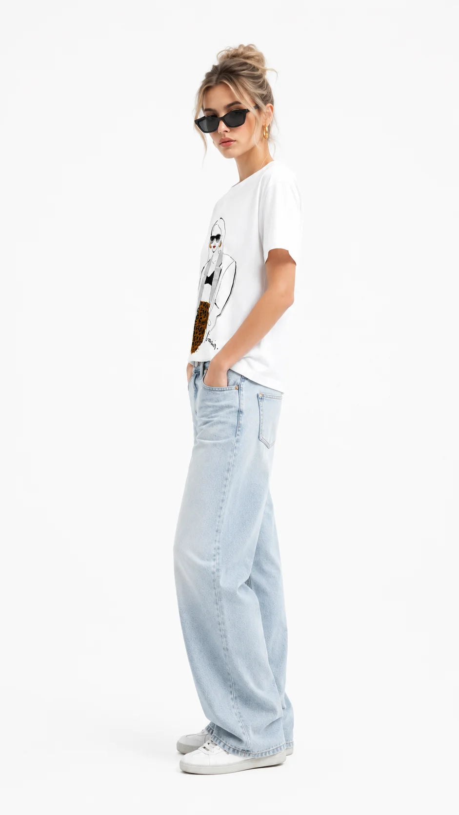 Side view of women's white printed cartoon character graphic t-shirt