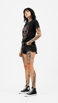 Women's rose rhinestone sugar skull t-shirt with red design, front view model