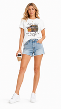 Women's coffee house rhinestone book t-shirt with Just a Girl vintage cafe design, front view model