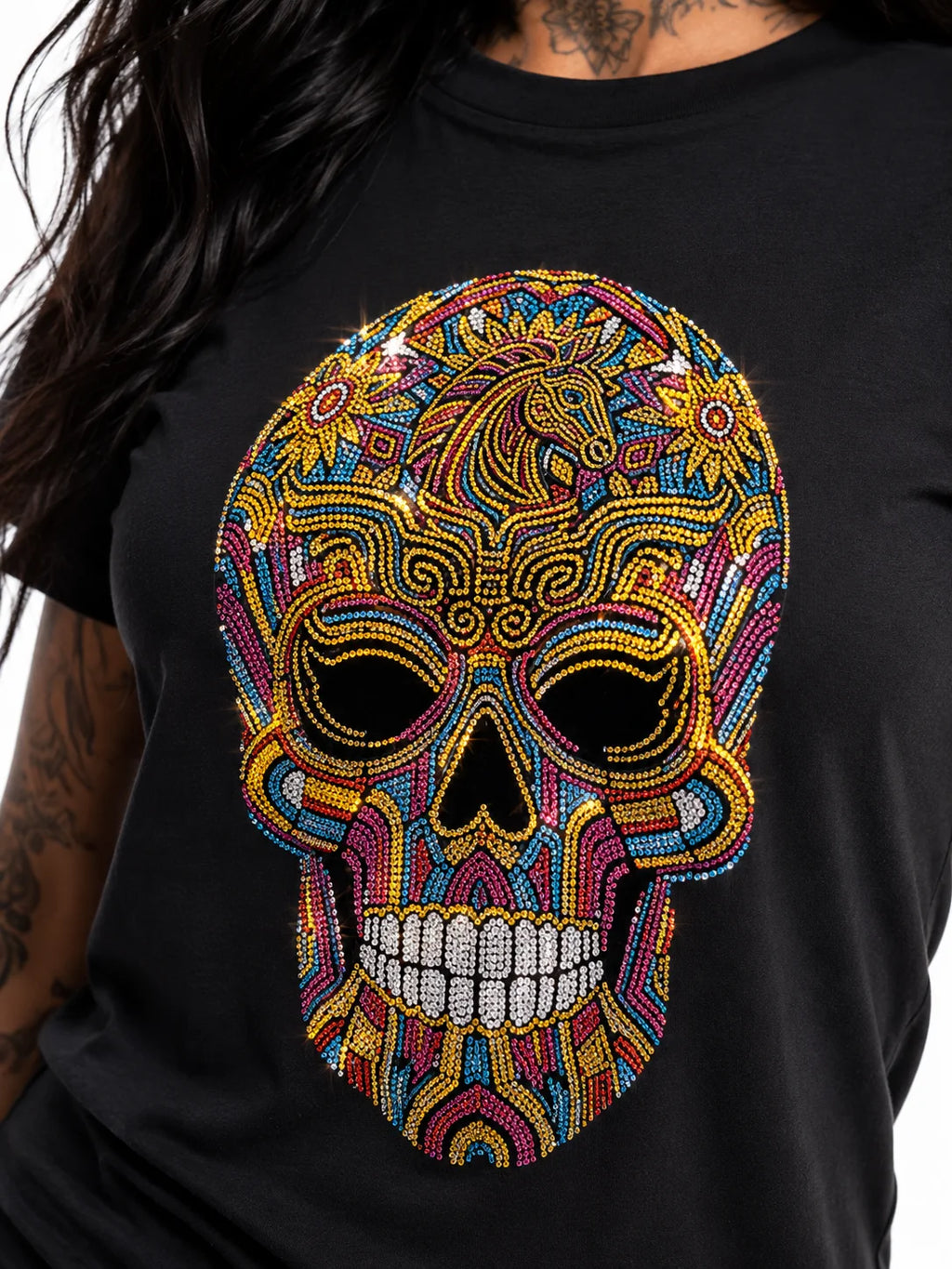 Close-up of vibrant multicolor rhinestone sugar skull Day of the Dead design showing dense crystal detail