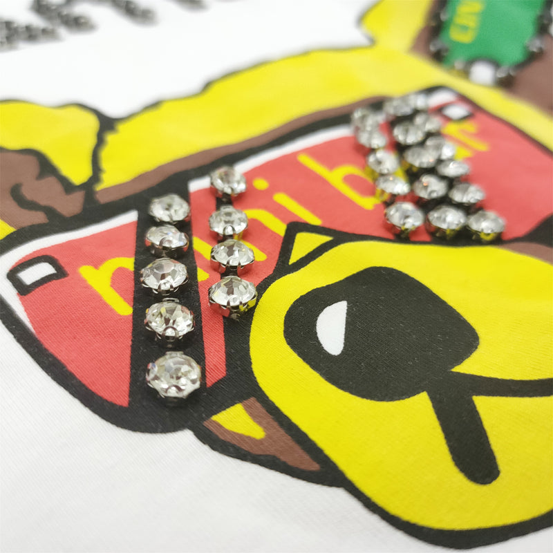 Hot-fix rhinestone application on women's T-shirt