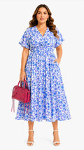 Women's blue floral woven midi dress with V-neck and flutter sleeves, front view model