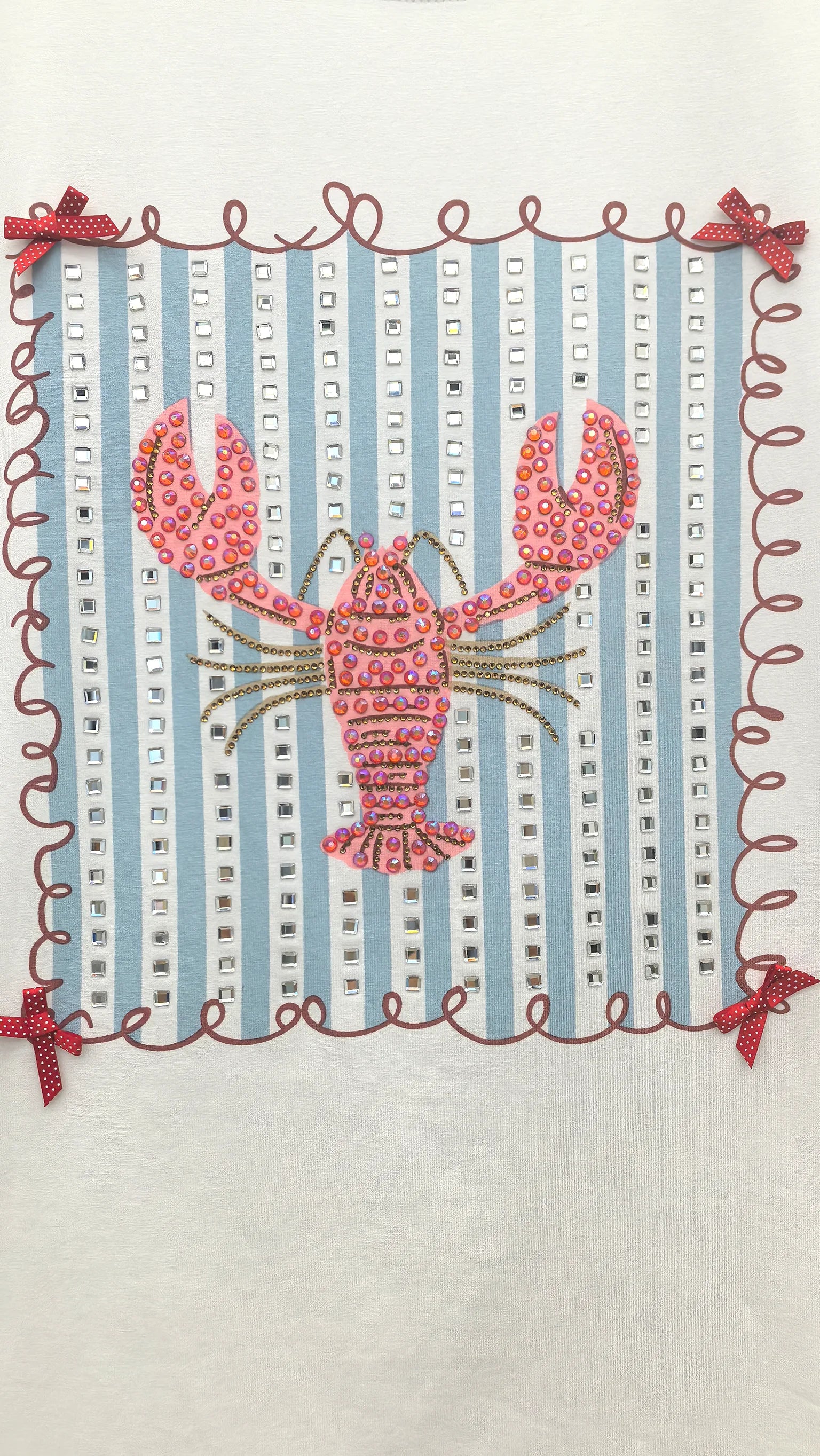 Close-up of intricate beadwork lobster design on t-shirt showing dense 3D bead embellishment detail