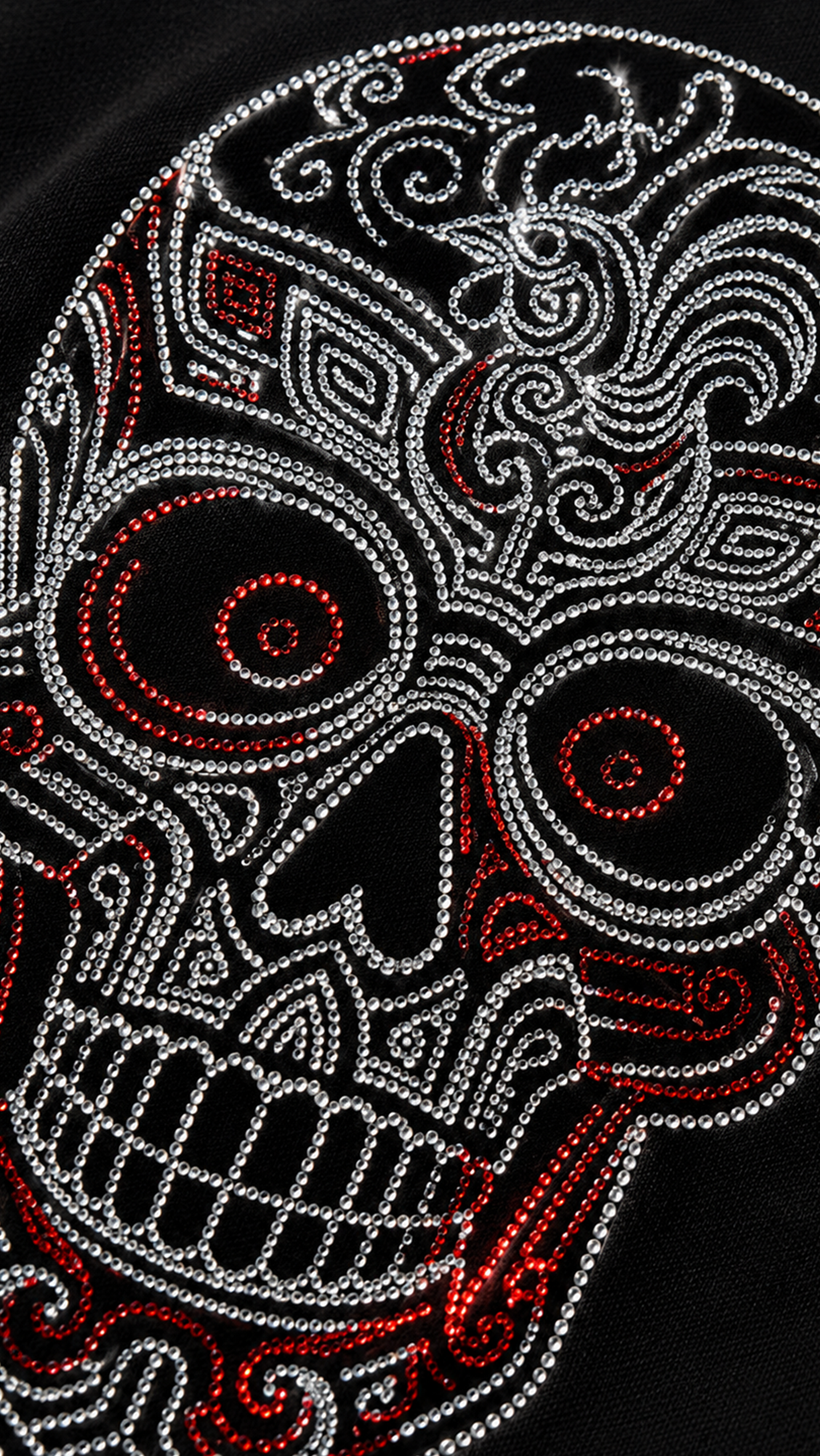 Close-up of rose red rhinestone sugar skull Day of the Dead design on black t-shirt showing crystal detail